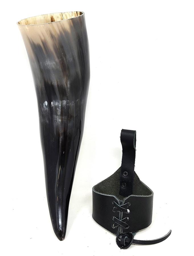 Viking-style horn with leather strap on a white background