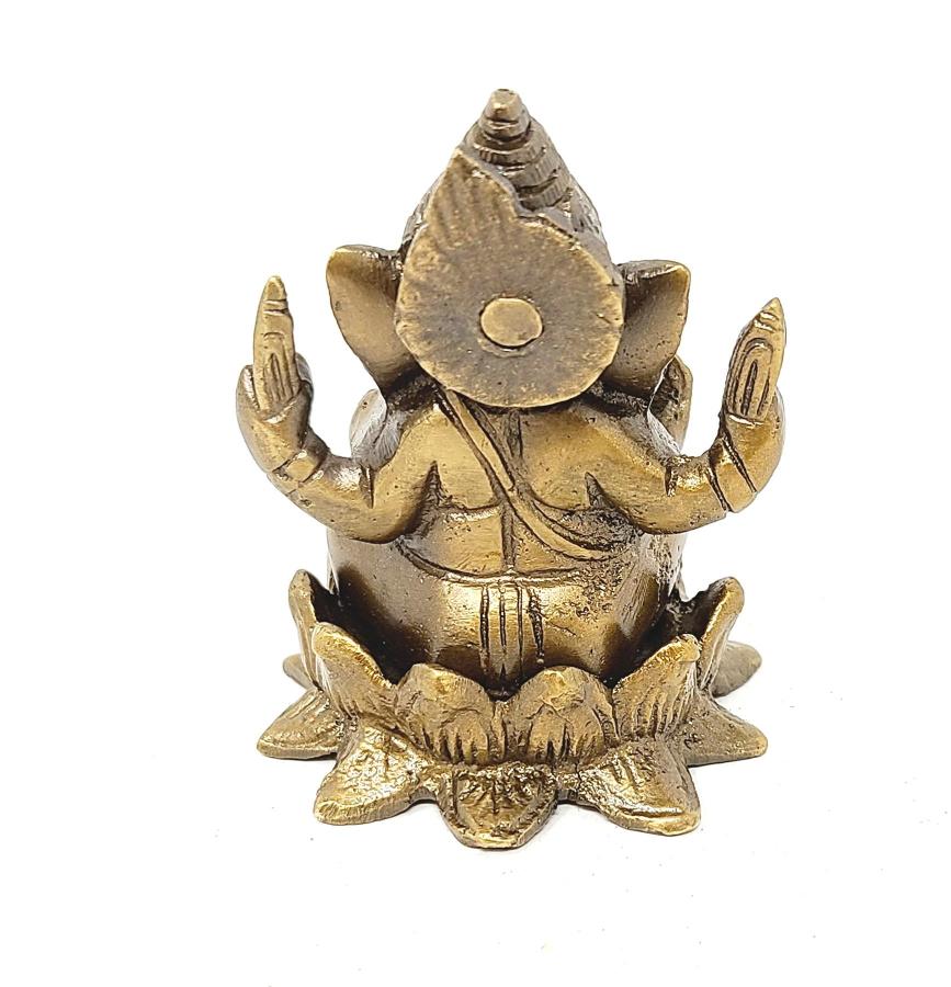 Brass Ganesha statue on a white background