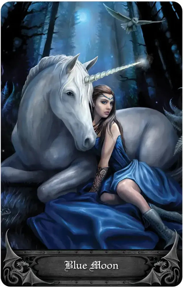 Fairy sitting on a unicorn with a blue dress in a forest setting, titled 'Blue Moon'.