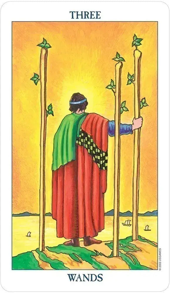 Tarot card featuring a figure holding two wands with a yellow background