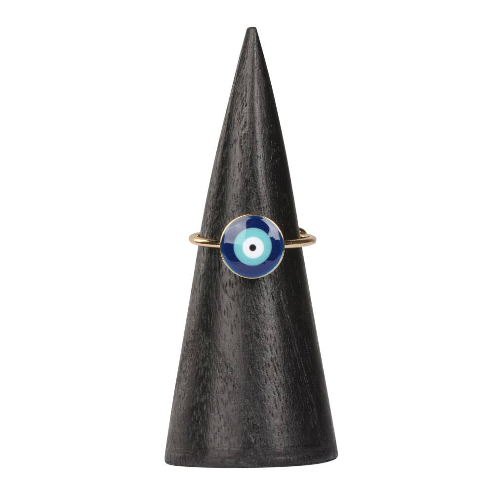 Ring with a blue and white eye design on a black cone-shaped stand against a white background