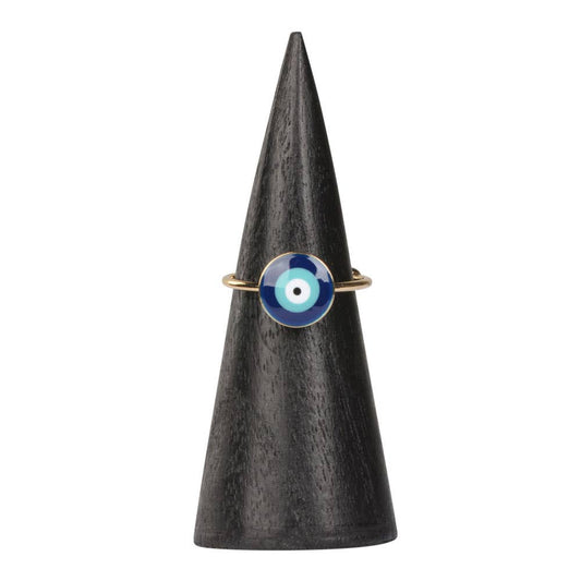 Ring with a blue and white eye design on a black cone-shaped stand against a white background