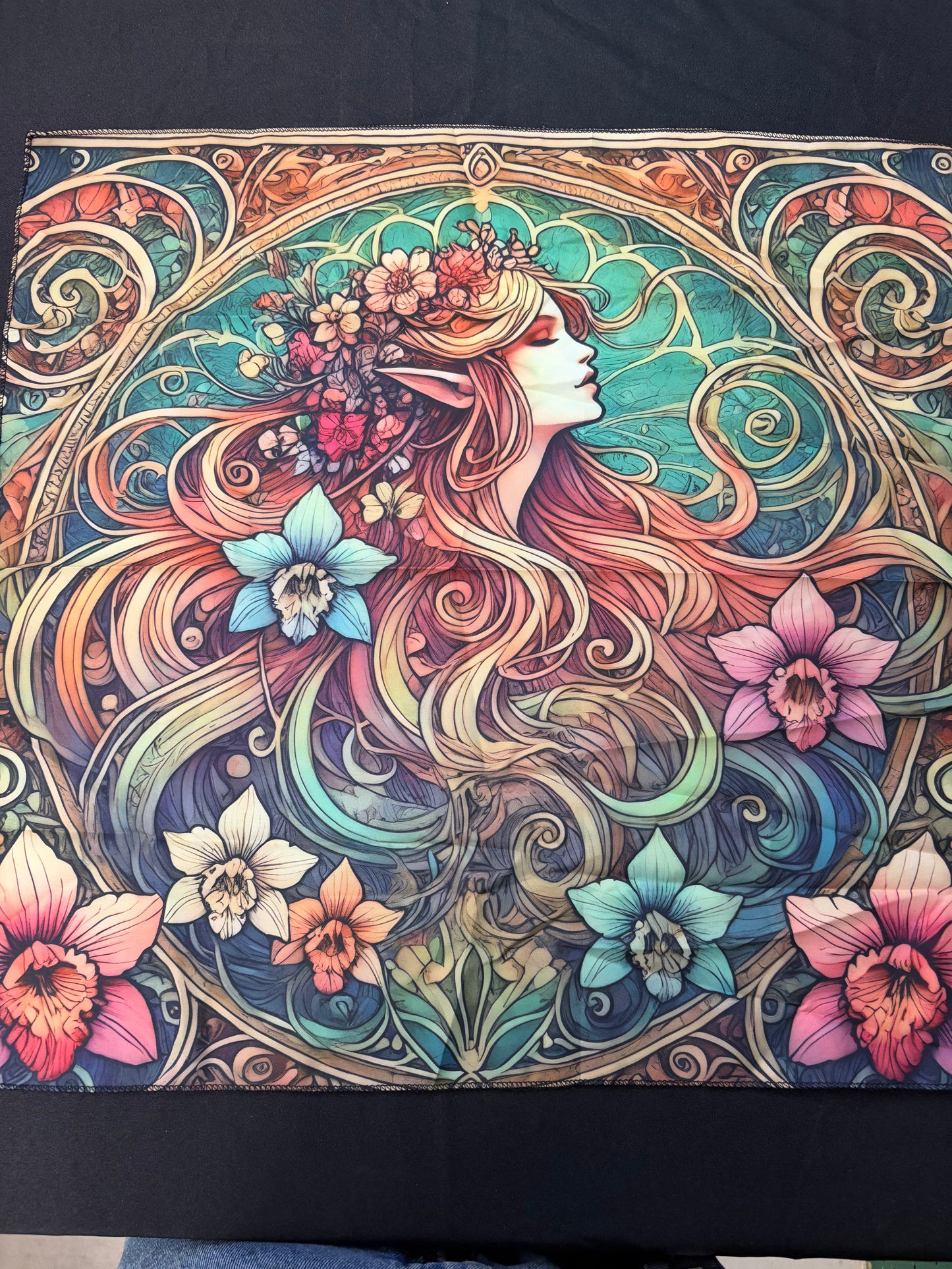Colorful art piece of a woman with flowing hair and flowers, on a black background.