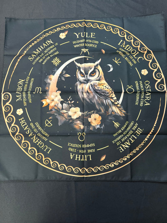Black and gold circular design with an owl and astrological symbols on a dark background
