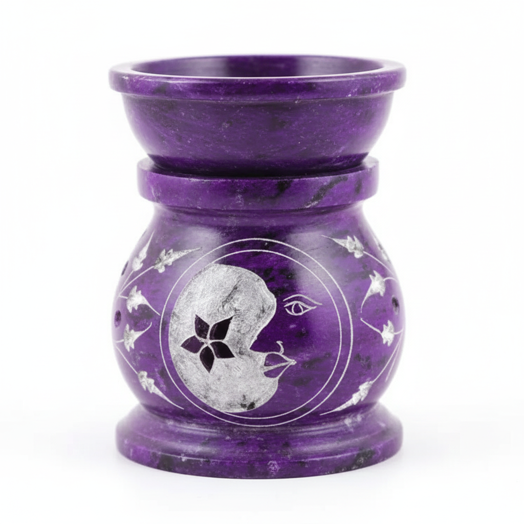 Purple stone oil burner with moon and star design on a white background