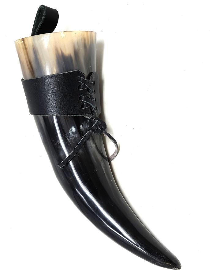 Black horn with leather strap on a white background