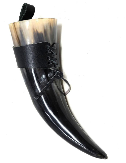 Black horn with leather strap on a white background