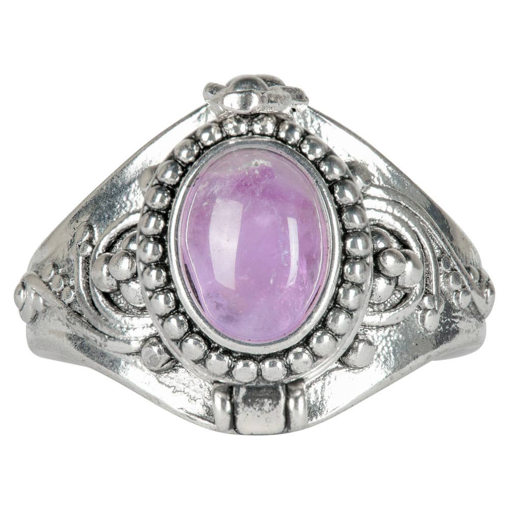 Silver ring with a purple gemstone on a white background