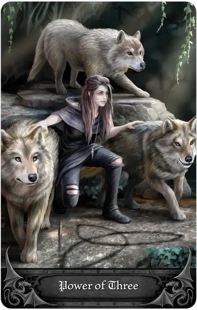 Woman sitting with three wolves on a stone platform, with 'Power of Three' text at the bottom.
