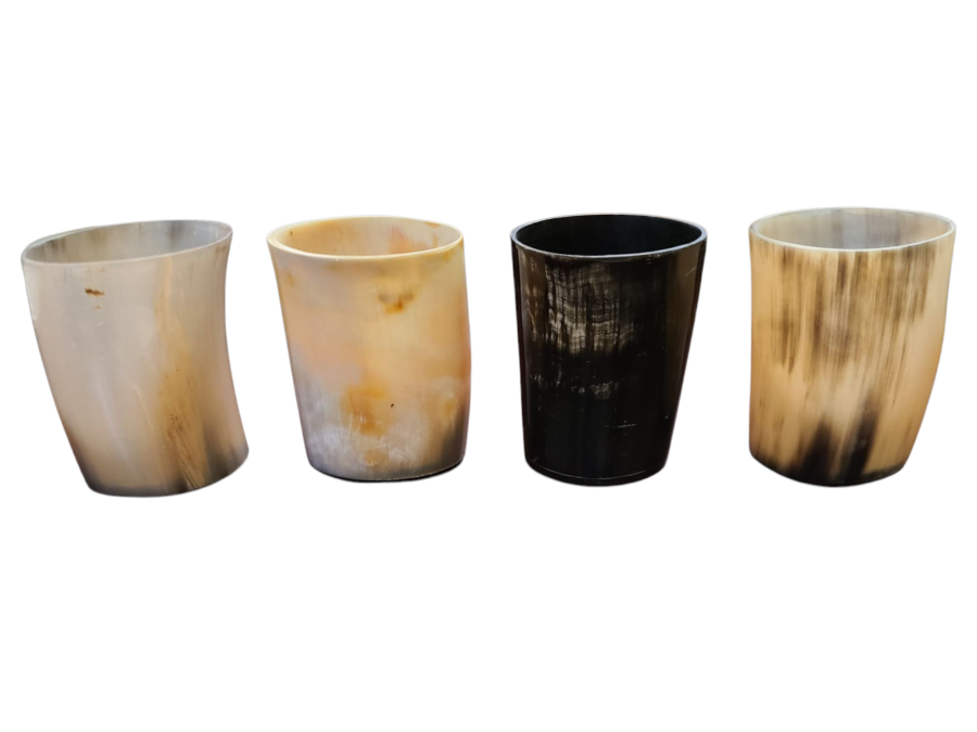 Four horn-shaped cups with different color patterns on a white background