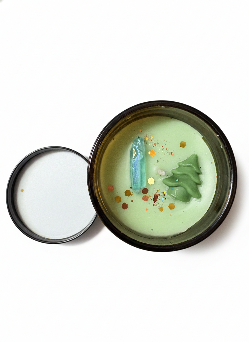 Green candle in a tin with decorative elements on a white background