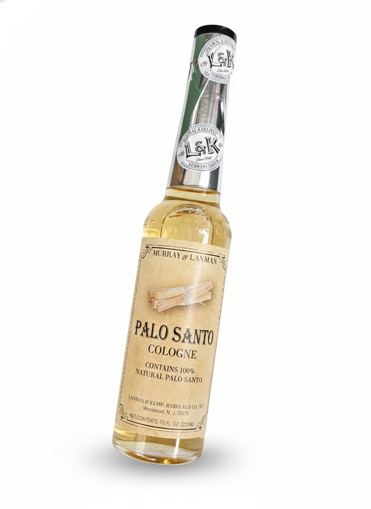 Bottle of Palo Santo cologne with a label on a white background