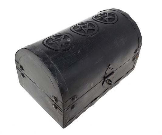 Black wooden chest with pentagram designs on a white background
