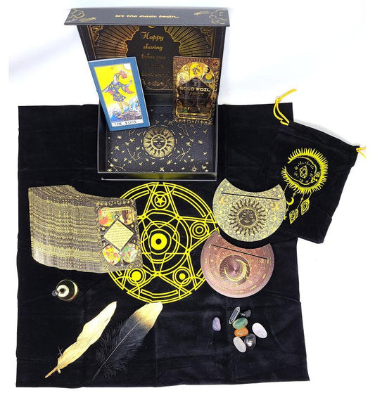 tarot card set with black pouch, cards, and accessories on a white background