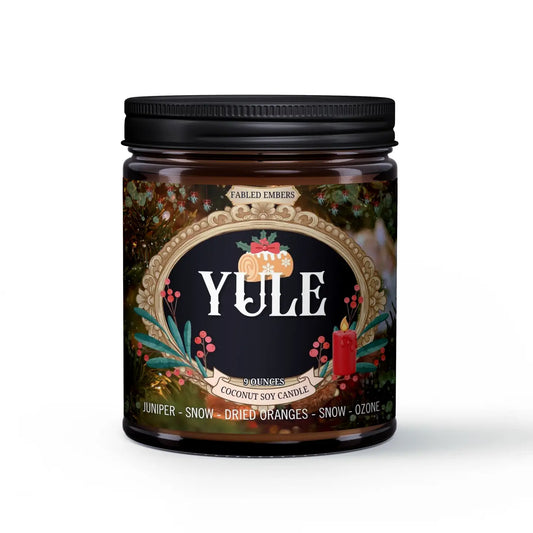 Yule candle jar with decorative label on a white background